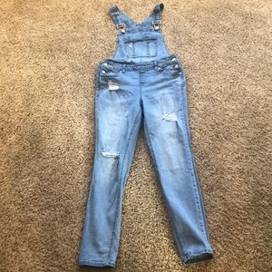 Distressed skinny overalls